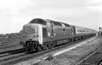 As the down Flying Scotsman sweeps through Tweedmouth in September 1970 behind D9012 <I>Crepello</I> it will already be braking for the passage of Berwick station but then it will be the usual banshee wail as it accelerates away to the north - that was how I first experienced a Deltic in 1961 and it was something never to be forgotten. I was leaning over the wall just north of the then A1 overbridge at Berwick trying to read the number of a J39 which was shunting the yard when a Deltic went through non-stop. It was going too fast to be identified but I was mightily impressed!			<br><br>[Bill Jamieson 19/09/1970]