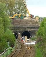 A view north west towards Farnworth Tunnel on 10 May 2015 showing the first stages of the engineering work to enlarge the right hand tunnel to allow for double track and electrification. The smaller tunnel on the left (normally for Bolton bound services) is currently set up for bi-directional working.<br><br>[John McIntyre 10/05/2015]