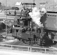 Giesl ejector fitted 0-6-2RT No. 97 208 stands beside the coaler at Vordernberg in Steiermark, Austria, in April 1976, prior to heading a mid-morning train of empty iron ore hoppers forward to the workings at Eisenerz. An electric loco will have brought its train from the Donawitz steelworks near Leoben.<br><br>[Bill Jamieson 13/04/1976]