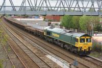An engineers train being worked by Freightliner 66530 waits in the Up Passenger Loop at Burnden, just south of Bolton, on 10 May 2015.<br><br>[John McIntyre 10/05/2015]