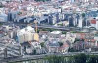 View of Grenoble's main station, in the centre of the picture, seen from the heights of the Bastille, across the River Isre in July 2014. A dual voltage Class BB22200 in TER 'En Voyage' livery heads up a regional express service. This now 200 strong class was built by Alstom between 1976 and 1986.<br><br>[Andrew Wilson 07/07/2014]