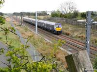 The 1048 Edinburgh Waverley - Helensburgh Central approaching Forrestfield, North Lanarkshire, on 15 May 2015.<br><br>[John Furnevel 15/05/2015]