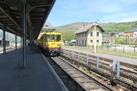 Metre gauge EMU motor coach No 109 is at the terminus station of Latour de Carol/Enveitg on the Ligne de Cerdagne - also known as the Train Jaune.  In reaching the station on its journey from Villefranche sur Conflent the train has climbed gradients as steep as 6% and passed through France's highest station at Bolqure Eyne (1592m).<br><br>[Malcolm Chattwood 12/05/2015]