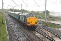 The 2015 timetable sees the welcome introduction of two loco hauled diagrams on the Cumbrian Coast line. On weekday mornings one of the sets makes a return run through to Preston and on Saturdays there is a return trip to Lancaster. On the first day of operations, DRS 37605 is seen in atrocious weather at Hest Bank on its way to Barrow-in-Furness with a four-coach train worked down from Carlisle to Preston that morning. ETS fitted 37419 was on the rear.   <br><br>[Mark Bartlett 18/05/2015]