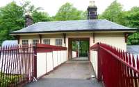 Looking north from Fotheringay Road towards Terregles Avenue through the upper level of the station building at Maxwell Park on a wet Sunday morning in May 2007.<br><br>[John Furnevel 06/05/2007]