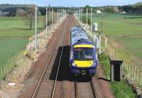 Bases and masts now in evidence on the Edinburgh & Glasgow route just over a mile east of Linlithgow on 19th May 2015 as a mid-afternoon Edinburgh - Glasgow Queen Street service approaches.<br><br>[Colin McDonald 19/05/2015]