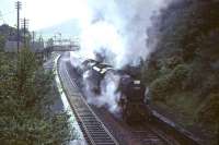 Black 5 45359 and an unidentified classmate struggle to restart a long train of empty stock from the up loop and on through Abington station on 30 July 1966 during heavy rain. [See image 51334]  <br><br>[John Robin 30/07/1966]