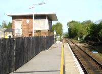The disused modernist flat roofed former signal box at Crewkerne, still standing to the rear of the London bound platform in May 2015. [See image 51408]<br><br>[David Pesterfield 11/05/2015]