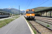 The station at Latour de Carol/Enveitg is notable (perhaps unique) for the presence of three conventional rail gauges and three power supplies in one station. Visible from the left are SNCF stock for a later service to Paris (1435mm/1500v DC overhead), a service for Barcelona with Renfe Class 447 (1665mm/3000v DC overhead) and SNCF Ligne de Cerdagne (1000mm/850v DC third rail).<br><br>[Malcolm Chattwood 12/05/2015]