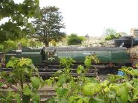Looking across the running lines at Swanage on the afternoon of 13 May 2015. Former Southern Railway Bulleid Battle of Britain Class Pacific 34070 <I>Manston</I> is stabled across the turntable in front of the one engine single track Swanage engine shed to its rear. <br><br>[David Pesterfield 13/05/2015]