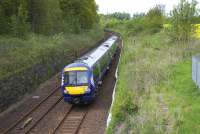 Having just passed Winchburgh Junction, a  Dunblane - Edinburgh service approaches Winchburgh tunnel on 23rd May 2015. No sign of  EGIP activity here yet, although masts are in place a few miles further west. The tunnel is due to close for EGIP electrification works in just a few weeks time.<br><br>[Colin McDonald 23/05/2015]