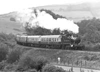 One of the first escapees from Barry scrapyard, ex-GWR 4575 class 2-6-2T No. 4588, was restored to running order by BREL at Swindon Works as early as 1971. The following year it was photographed on the Dart Valley Railway about half a mile outside Buckfastleigh with a train from Totnes Riverside (now Totnes Littlehempston on the South Devon Railway).<br><br>[Bill Jamieson 16/09/1972]
