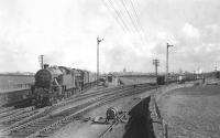 Ardrossan shed's Fairburn tank 42209 pilots Corkerhill Black 5 44791 through Dubbs Junction on 4 April 1959 with a boat express heading for Fairlie Pier.<br><br>[G H Robin collection by courtesy of the Mitchell Library, Glasgow 04/04/1959]