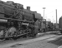 A shed bash on the last Saturday of August 1975 in Ruhr area of West Germany took in four different sheds of which Oberhausen Osterfeld Sd was perhaps the most disappointing photographically, with only a meagre fifteen class  50s present and most of these were hidden away in the shed. However a number were stabled outside in the vicinity of the coaler and water columns, so that a few pleasing images were obtained, including this one of 051.235 (left) with 052.545 beyond. <br><br>[Bill Jamieson 30/08/1975]