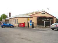 Looking north towards Frome station with its recently repainted fully enclosed wooden train shed and attached single storey station building. The southbound platform is not used, although a newly painted waiting room remains [See image 51450]. The single bi-directional track runs alongside the nearest platform.  <br><br>[David Pesterfield 08/05/2015]