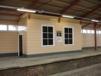 The freshly painted waiting room on the disused former down side platform at Frome Station in May 2015. The lower notice indicates a partnership between Network Rail and Frome Station Friends to enhance the station and its environs.<br><br>[David Pesterfield 08/05/2015]