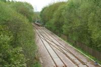 The temporary crossover to cater for single line working through Farnworth Tunnel is seen here on 10 May 2015. The down platform of Kearsley station stands in the background.<br><br>[John McIntyre 10/05/2015]