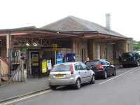 The up side building at Yatton Station, between Bristol Temple Meads and Bridgwater, looking approx. south west on a Sunday afternoon in May. A near identical building exists on the down side platform. West of Yatton were the junctions for the Cheddar Valley line, which turned south from a bay platform on the down side, and for the Clevedon branch which turned north from a bay platform on this side. Part of the canopy for the latter platform can be seen on the extreme right. [See image 51843]<br><br>[David Pesterfield 10/05/2015]