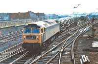 Immingham allocated Brush Type 4 No. 1882 passes Craigentinny Depot with the 21:00 Dagenham to Bathgate Upper loaded Cartic 4s. On weekdays this train ran via Millerhill Yard and the Sub, but the 25th April 1970 was a Saturday so it should have stayed on the ECML at Monktonhall Junction and is certainly running via Waverley station where a crew change was booked. <br><br>[Bill Jamieson 25/04/1970]