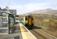A Llandudno - Blaenau Ffestiniog service leaving Roman Bridge on 10th April 2015. This station is of very similar construction to Pont-y-Pant (two stops along the line towards Llandudno junction) and until recently was available for self catering holidays.<br><br>[Colin McDonald 10/04/2015]