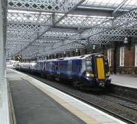 Four-car 380104 with an Ayr Service at Paisley Gilmour Street on Saturday 30 May. Too early in the morning, and the season, to attract much day-trip custom.<br>
<br><br>[David Panton 30/05/2015]