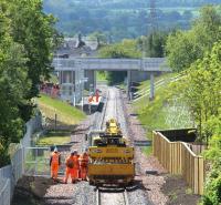 Looking south towards the new Eskbank station on a sunny 3 June 2015 from the A6094 road bridge. Beyond the station the line swings left onto Hardengreen Viaduct. <br><br>[John Furnevel 03/06/2015]