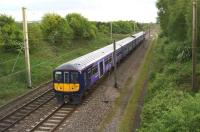 The 1800 'Northern Electrics' Liverpool to Preston service heads north along the WCML to the north of the former Standish station site on 2 June 2015.<br><br>[John McIntyre 02/06/2015]