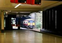 SPT liveried 318261 about to exit High Street Tunnel and enter Glasgow Queen Street Low Level station in July 2005 on a Springburn - Dalmuir service.<br><br>[John Furnevel 30/07/2005]