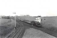 One of Ayr shed's <I>Crab</I> 2-6-0s no 42916 brings a westbound goods train through Mossblown Junction on 24 May 1962 heading for home. <br><br>[G H Robin collection by courtesy of the Mitchell Library, Glasgow 24/05/1962]