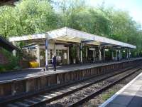 View west along the down platform at Sherborne on 12 May, with anxious looks from passengers awaiting the 09.35 to Exeter (07.10 ex Waterloo). South West trains 159106 arrived shortly afterwards running 33 minutes late. <br><br>[David Pesterfield 12/05/2015]