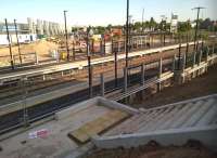 Almost there. Coventry Arena on 4 June 2015. Waiting shelters, green plastic seats, a Northbound platform, and a set of steps on the Arena side have been installed since my last shot in this direction [see image 50666].<br><br>[Ken Strachan 04/06/2015]