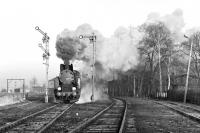 PKP 2-8-2T No. TKt48-111 sets off from Srem with the 07:06 Czempin to Jarocin stopping train on 25th February 1991. The German style signals indicate that the exit from the station is clear but at a restricted speed of 40km/h - it is not showing clear home and distant arms as in British practice.<br><br>[Bill Jamieson 25/02/1991]