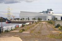 Looking along the former Yorkhill Quay towards the Riverside Museum on 9th June 2015. Rails and pointwork from the Stobcross branch sidings survive along the riverside but stop abruptly just off the bottom right of the picture at the point where the line formerly crossed Sandyford Street.<br><br>[Colin McDonald 09/06/2015]