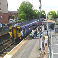 With the departure screen showing Glasgow Central only (all it ever does say), the same destination scrolling at the front of the 156 and the departure being announced twice, it is hoped these passengers weren't querying the destination with the driver. Scene at Crossmyloof on Saturday 30 May 2015.<br><br>[David Panton 30/05/2015]