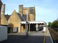 View east at the large and ornate Crewkerne Station on 11 May 2015 [see image 51347]. The canopy is sited towards the London end of the bi-directional former up side platform. <br><br>[David Pesterfield 11/05/2015]