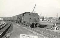 Hughes/Fowler <I>'Crab'</I> 2-6-0 no 42740 brings a train south past the site of the original Cathcart platform on 28 August 1957. [Ref query 6719]<br><br>[G H Robin collection by courtesy of the Mitchell Library, Glasgow 28/08/1957]