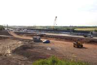 View from the north of the new bridge under construction on 12th June 2015. The supporting columns for the bridge are already sunk  in the embankments.<br><br>[Colin McDonald 12/06/2015]