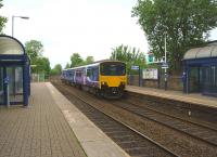 A Clitheroe to Manchester Victoria service passes through Church and Oswaldtwistle on 13 June 2015. With engineering work taking place on the line via Bolton, this service currently reverses at Blackburn and runs via the recently reopened Todmorden curve.<br><br>[John McIntyre 13/06/2015]