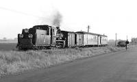 Between Snieciska and Polwica, the Sroda to Zaniemysl narrow gauge line ran alongside a quiet country road on which Px48-1726 on the 06:07 departure from Sroda Miasto is overhauling a cyclist. Or perhaps it was the other way round - certainly I had no problem chasing these trains by bicycle!<br><br>[Bill Jamieson 14/05/1994]