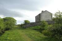 Two long-abandoned railway cottages standing alongside the trackbed of the SDLUR just east of the quarry and viaduct at Smardale Gill. View west on 8 May 2015.<br><br>[Brian Taylor 08/05/2015]