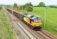 Colas 60087, with a Carlisle to Chirk log train on 16th June 2015, powers past the bridge at Elmsfield just south of Milnthorpe. The logs can be routed over Shap or via the S&C but when on the WCML take a leisurely five hours to get as far as Preston, with scheduled loops at Plumpton, Eden Valley, Grayrigg, Oxenholme and Oubeck although individual stops are sometimes omitted.<br><br>[Mark Bartlett 16/06/2015]