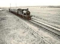 GNSR 4-4-0 62276 <I>Andrew Bain</I> at Kirkton with a down passenger train in the summer of 1953.<br><br>[G H Robin collection by courtesy of the Mitchell Library, Glasgow 05/08/1953]