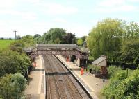 A London Midland maintenance gang tidying Wilmcote station on 15th June 2015. This view towards Stratford was actually a <I>grab shot</I> taken from the top deck of an open top sightseeing bus as it crossed the line. <br><br>[Mark Bartlett 15/06/2015]