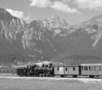 Against an impressive backdrop of the Rofangebirge, Zillertalbahn No. 4 rolls away from Strass im Zillertal towards Jenbach on the early afternoon steam working from Mayrhofen. At that time, two daily return services were being run during the peak season but this has now been reduced to one, rather limiting the photographic possibilities on the line. The remaining return working now takes place in the late afternoon so that the lighting is no longer optimal for this shot.<br><br>[Bill Jamieson 05/09/2005]