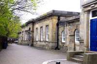 The former Durham Gilesgate terminus in May 2015. Durham's 2nd station, superseded by the current station for passenger use in 1857, was reached by a short branch from Belmont and continued as the city's goods station until November 1966. A classically elegant structure by GT Andrews, the main building is now a hotel, having served for many years as a builders' merchants.<br><br>[Brian Taylor 02/05/2015]