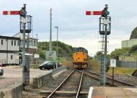 Framed by two  semaphores, 37606 leaves the short double track section from Parton and slows for the Whitehaven stop with the 2C34 Carlisle to Barrow afternoon service. Bransty box, just visible on the left, is one of eight between Bootle and Carlisle scheduled to close in 2019 with control passing to the Manchester regional signalling centre. [See image 2238] for an earlier view from this spot.   <br><br>[Mark Bartlett 22/06/2015]