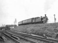 Class C15 67460 propels the Arrochar push-pull train towards the West Highland platforms at Craigendoran on 19 May 1959. The line running off to the left is for the Pier platform, while the Helensburgh Central lines pass below the footbridge. [See image 49155]    <br><br>[G H Robin collection by courtesy of the Mitchell Library, Glasgow 19/05/1959]