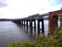 The 15.28 Edinburgh Waverley - Inverurie heading north across the Tay Bridge on 20 June 2015.<br><br>[Andrew Wilson 20/06/2015]