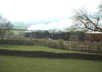 A light mist hangs over the moors at Long Preston on 29 April 1978 as Black 5s 45407+44932 pass on their way to York with a Steam Locomotive Operators Association railtour from Carnforth.<br><br>[John Robin 29/04/1978]