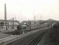 V1 67661 with a Clydebank East - Springburn train passing below Royston Road and through the site of the former Garngad station, three quarters of a mile short of its ultimate destination, on 8 May 1956. Garngad station had closed to passengers in 1910.   <br><br>[G H Robin collection by courtesy of the Mitchell Library, Glasgow 08/05/1956]